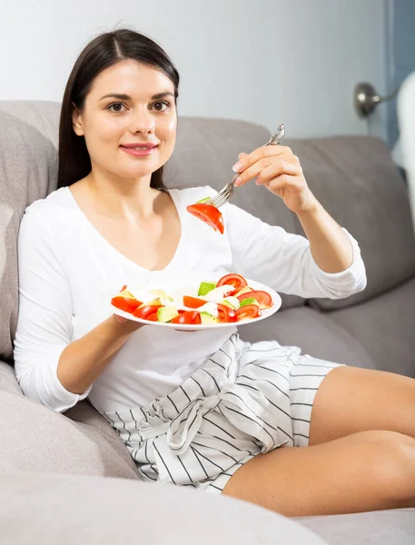 Satisfied Brunette Sitting Sofa Eating Salad — Stock Photo, Image