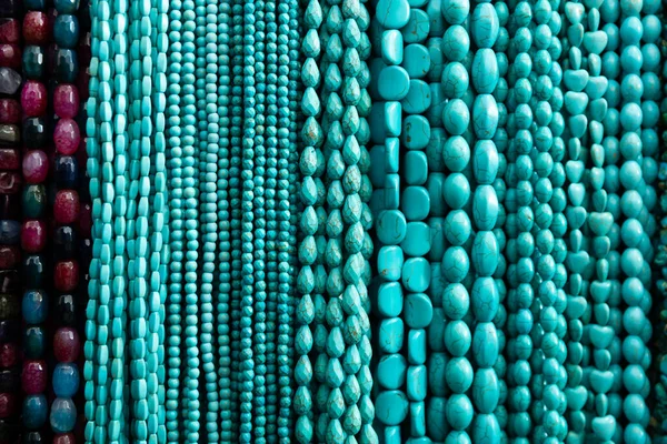 Closeup Beads Different Shapes Turquoise Strung Threads Displayed Stand Store — Stock Photo, Image