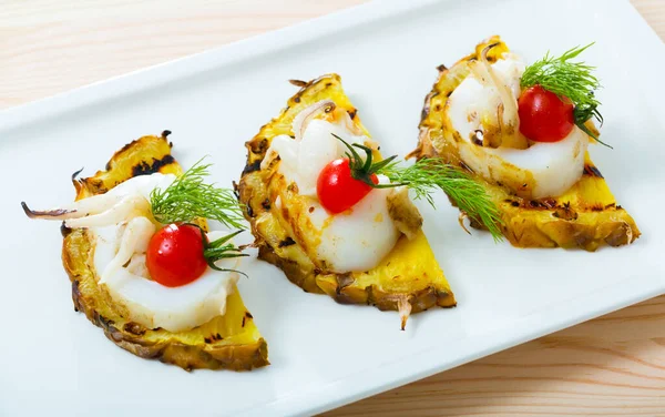 Cuttlefish grilled with pineapple and cherry tomatoes and sweet and sour sauce Chile
