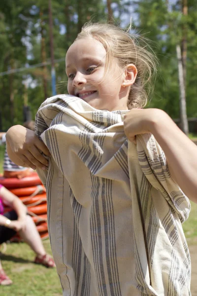 Girl jumping in the sack — Stock Photo, Image