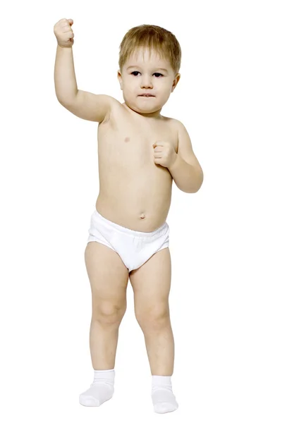 Sweet little boy stands with his hands clenched into fists — Stock Photo, Image