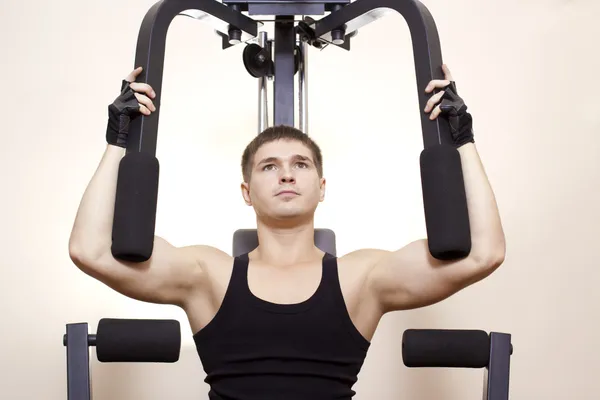 Man in a gym room — Stock Photo, Image