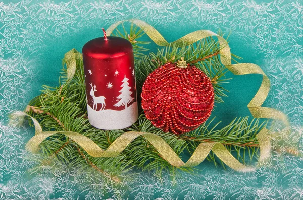 Christmas decorations with candle and spruce — Stock Photo, Image