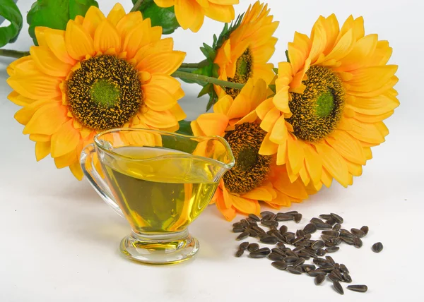 Sunflower seeds and vegetable oil — Stock Photo, Image