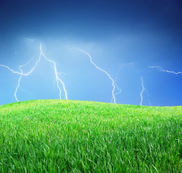 Lightning and green meadow — Stock Photo, Image