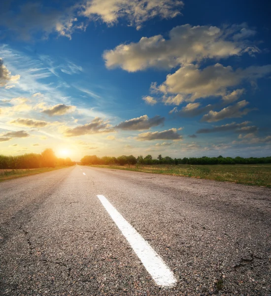 Deep road on sunset — Stock Photo, Image