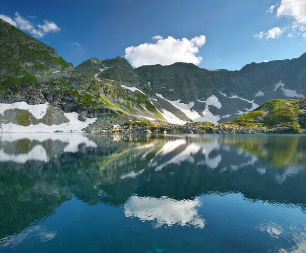 Beautiful summer landscape of Caucasus mountain. Arkasar Dukka lakes near Arkhyz village in Russia. Daylight mountain landscape.