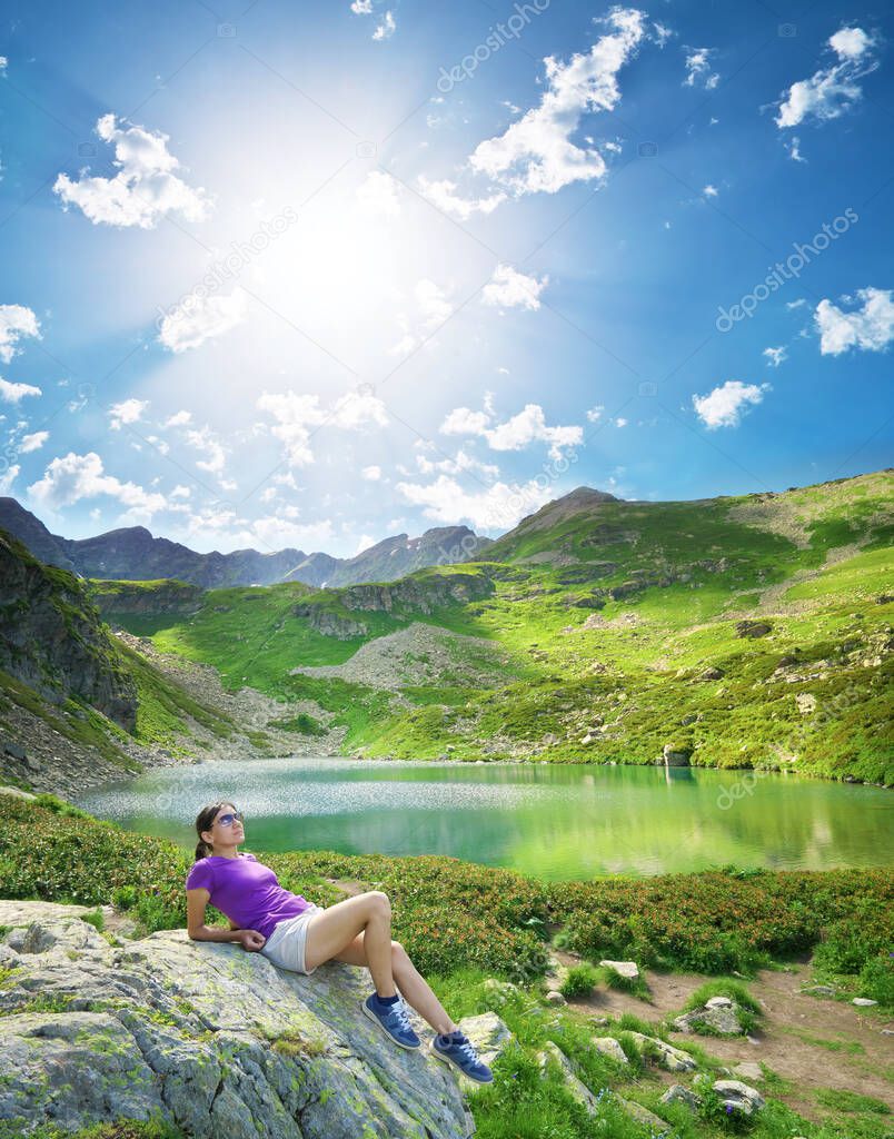 Landscape of Caucasus Dukka lake in mountain. Person and nature. Travel and relax scene.