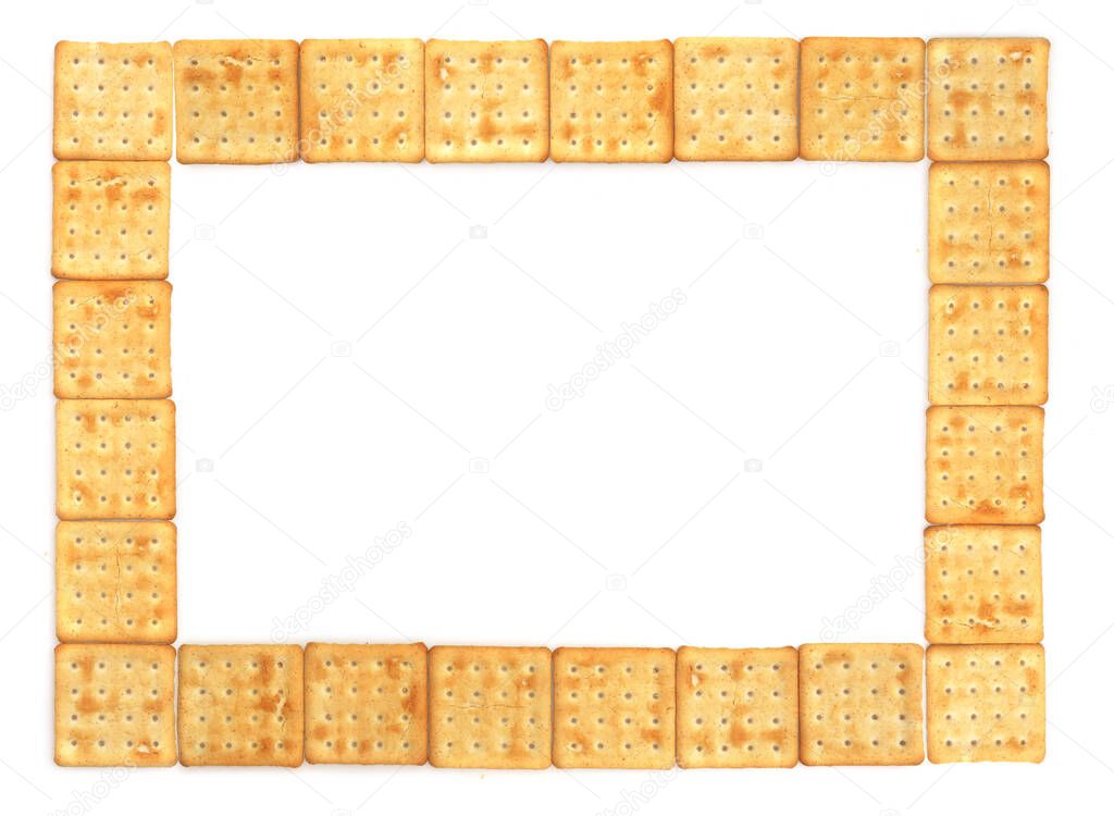 Frame of crispy salted cracker isolated on a white background, top view, close up.