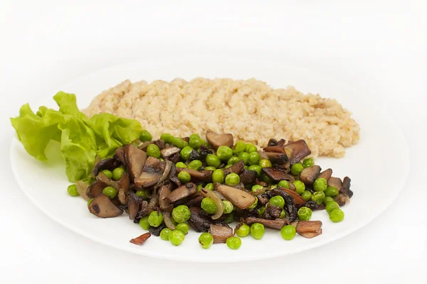 Mushrooms and green peas — Stock Photo, Image