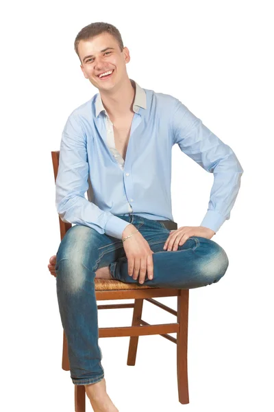 Guy sitting on a chair — Stock Photo, Image