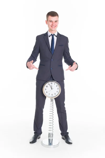 Бізнесмен в костюмі та високі підлоговий годинник — Stok fotoğraf