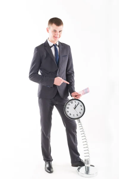 Businessman in a suit and a grandfather clock — Stock Photo, Image