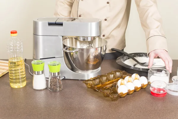 Cook prepares dough for pancakes — Stock Photo, Image