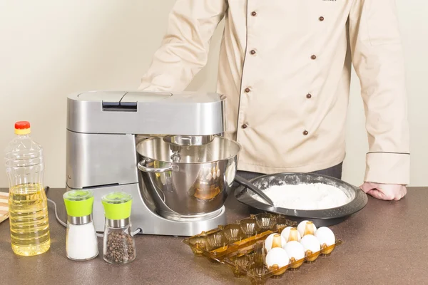 Cook prepares dough for pancakes — Stock Photo, Image
