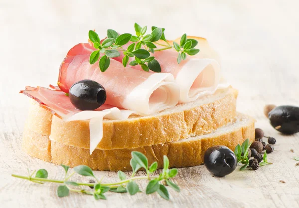 Sandwich on a wooden table — Stock Photo, Image