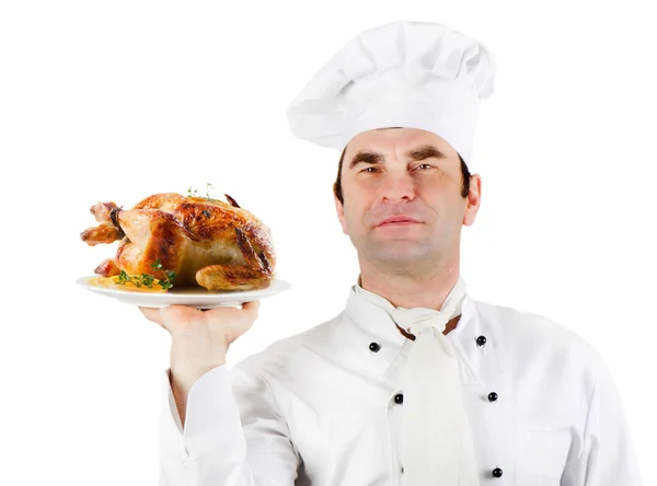 Chef holding plate with roasted chicken isolated over white bac — Stock Photo, Image