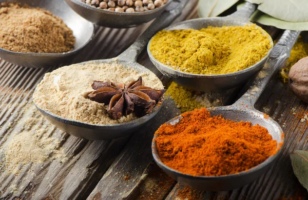 Assortment of powder spices on spoons — Stock Photo, Image