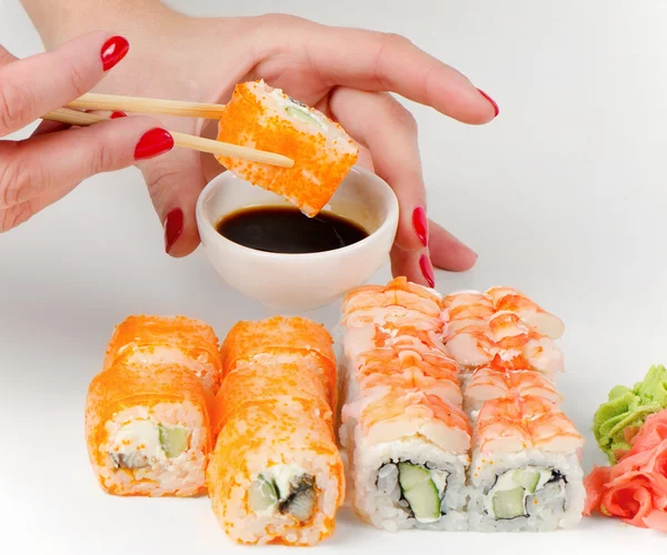 Sushi on chopstick — Stock Photo, Image