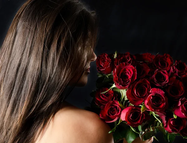 Beautiful woman with flowers — Stock Photo, Image