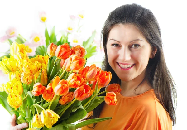 Beautiful happy woman with tulips — Stock Photo, Image