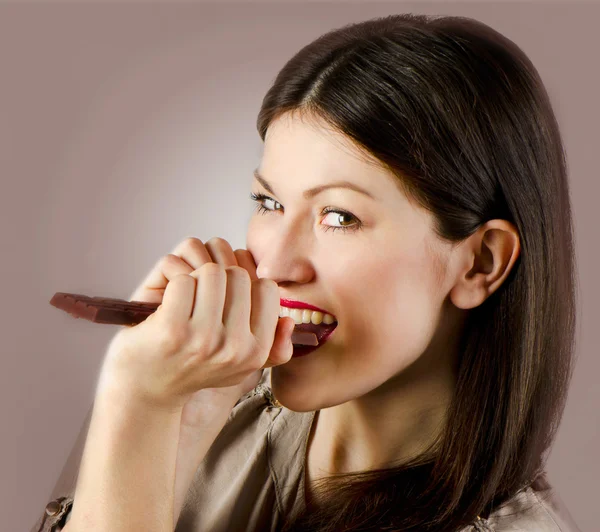 Young happy woman with chocolate — Stock Photo, Image