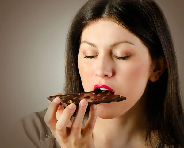 Woman with with a chocolate bar — Stock Photo, Image