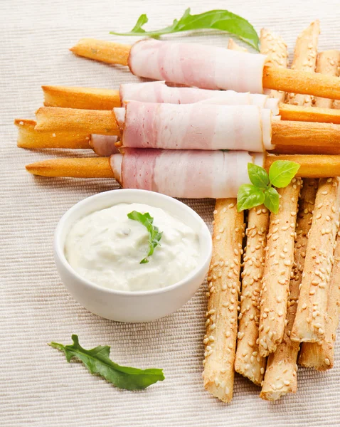 Bread sticks with bacon and herbs — Stock Photo, Image