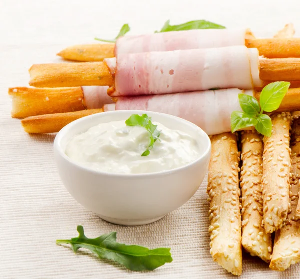 Bread sticks with bacon and herbs — Stock Photo, Image