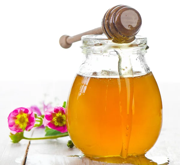 Glass jar of honey — Stock Photo, Image