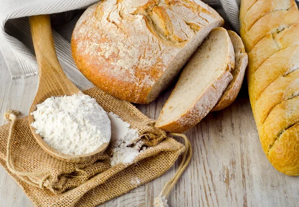 Bread on wooden table — Stock Photo, Image