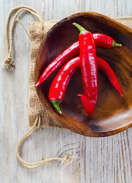 Chili pepper on wooden table — Stock Photo, Image