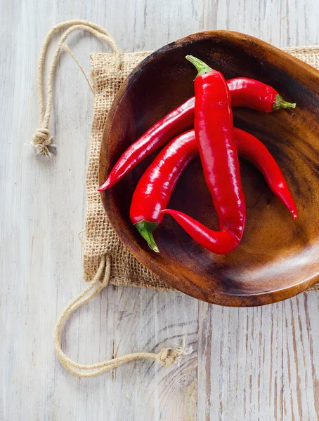 Chili pepper on wooden table — Stock Photo, Image