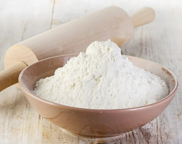 Flour on wooden table — Stock Photo, Image