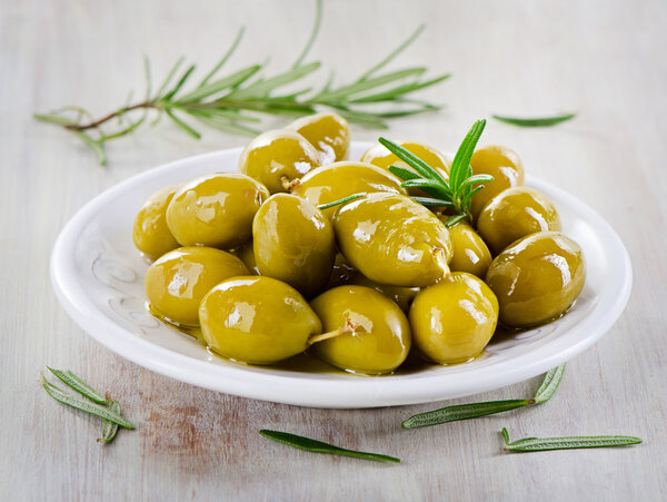 Green olives with herbs.