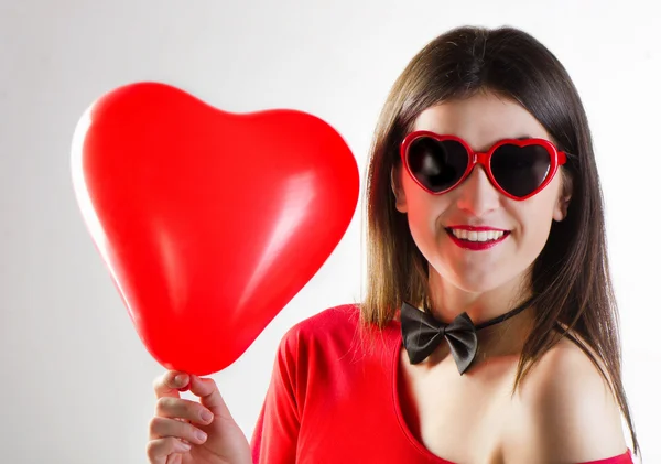 Smiling girl with heart glasses — Stock Photo, Image