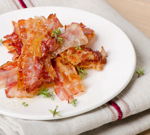 Cooked bacon rashers — Stock Photo, Image