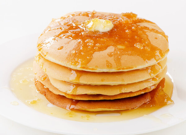 pancakes topped with honey
