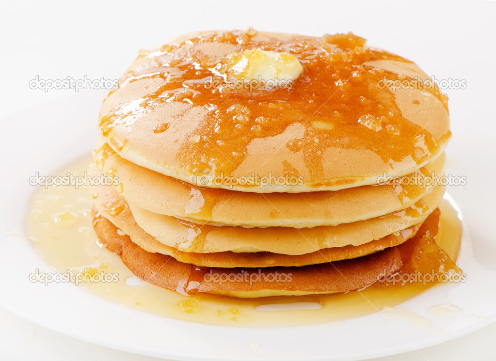 pancakes topped with honey