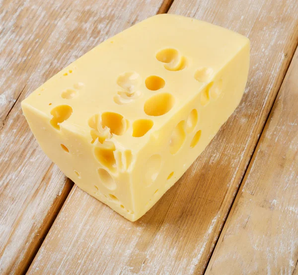 Cheese on wooden table — Stock Photo, Image