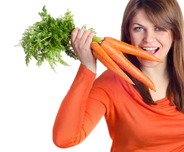 Woman holds bunch of carrots — Stock Photo, Image