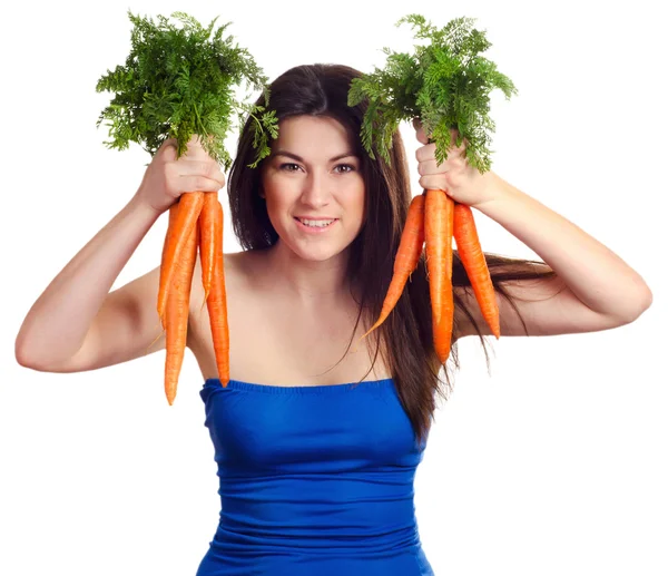 Woman holds bunch of carrots — Stock Photo, Image