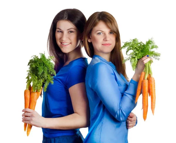 Mujeres sostiene racimo de zanahorias — Foto de Stock