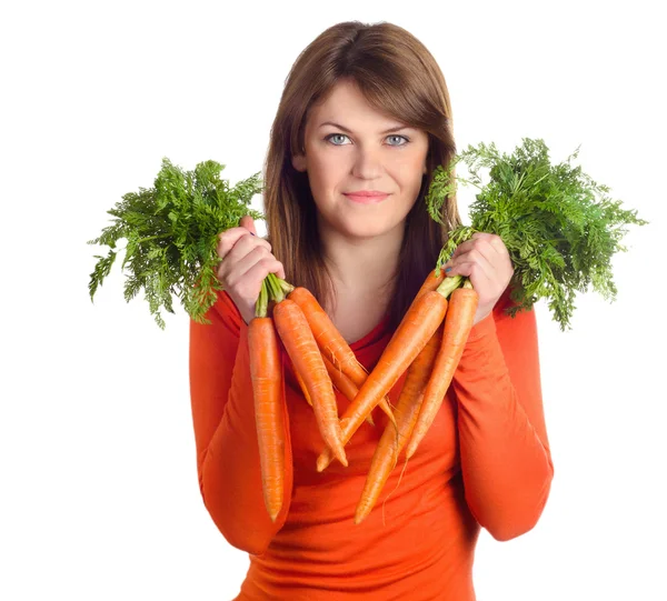 Woman holds bunch of carrots Stock Image
