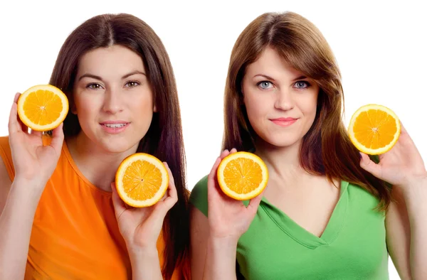 Two women with orange — Stock Photo, Image