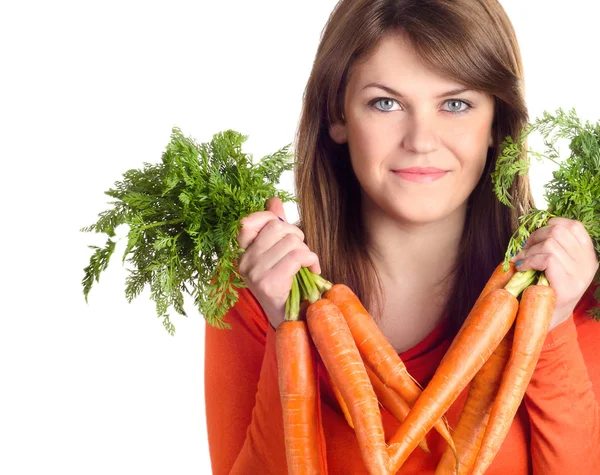 Woman holds bunch of carrots Royalty Free Stock Photos
