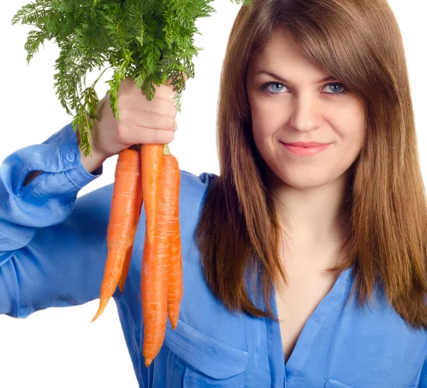 Woman holds bunch of carrots Royalty Free Stock Images