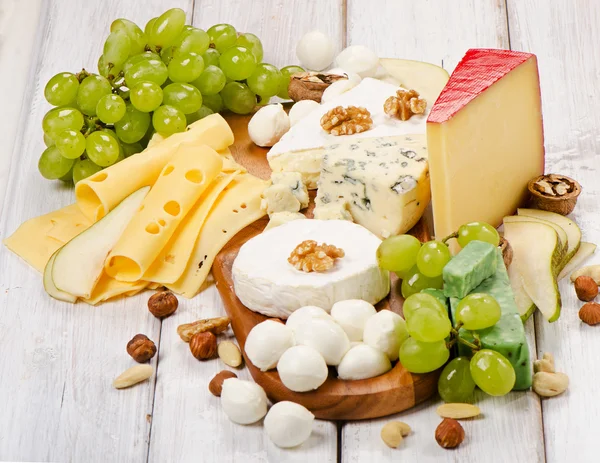 Cheese with fruits and nuts — Stock Photo, Image