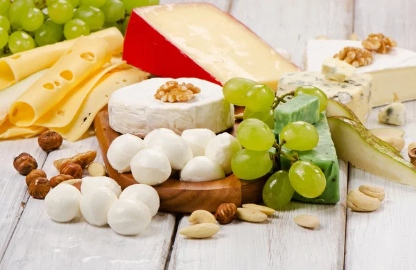 Cheese with fruits and nuts — Stock Photo, Image