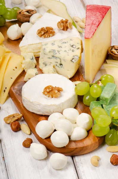 Cheese with fruits and nuts — Stock Photo, Image